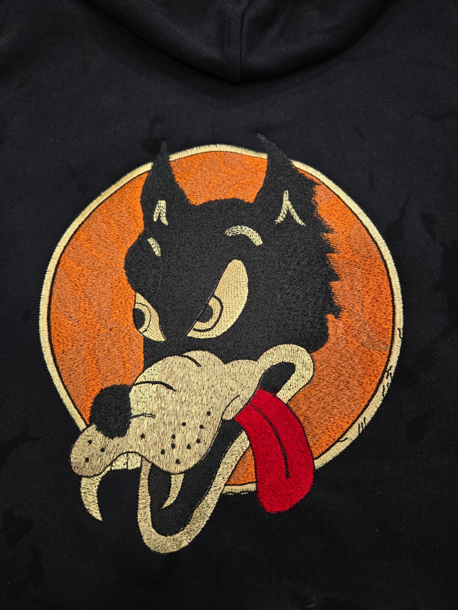 Detailed embroidered dog artwork on a black hoodie produced by 3 Day Prints