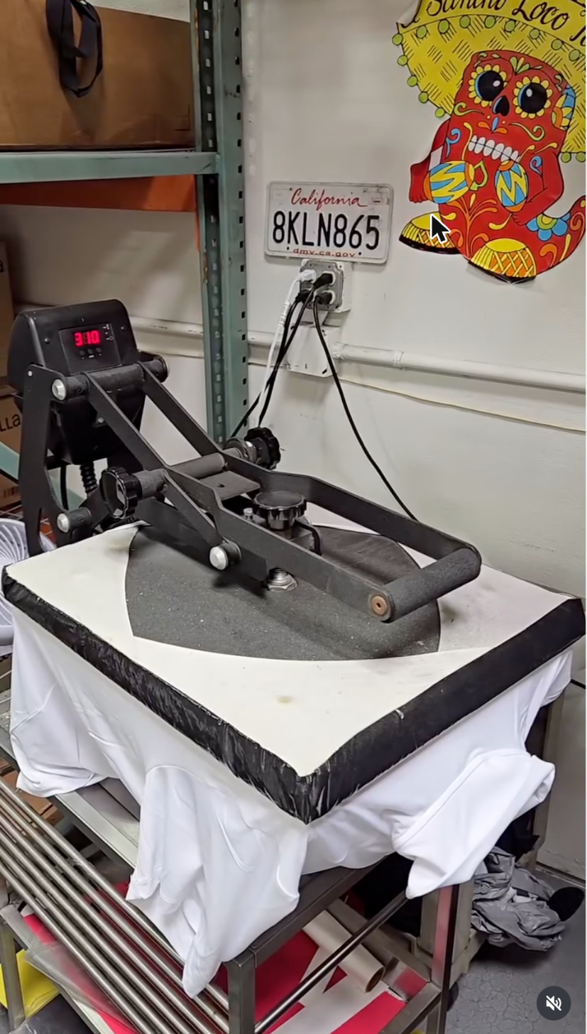 Pressing a custom t-shirt in the 3 Day Prints Camarillo shop
